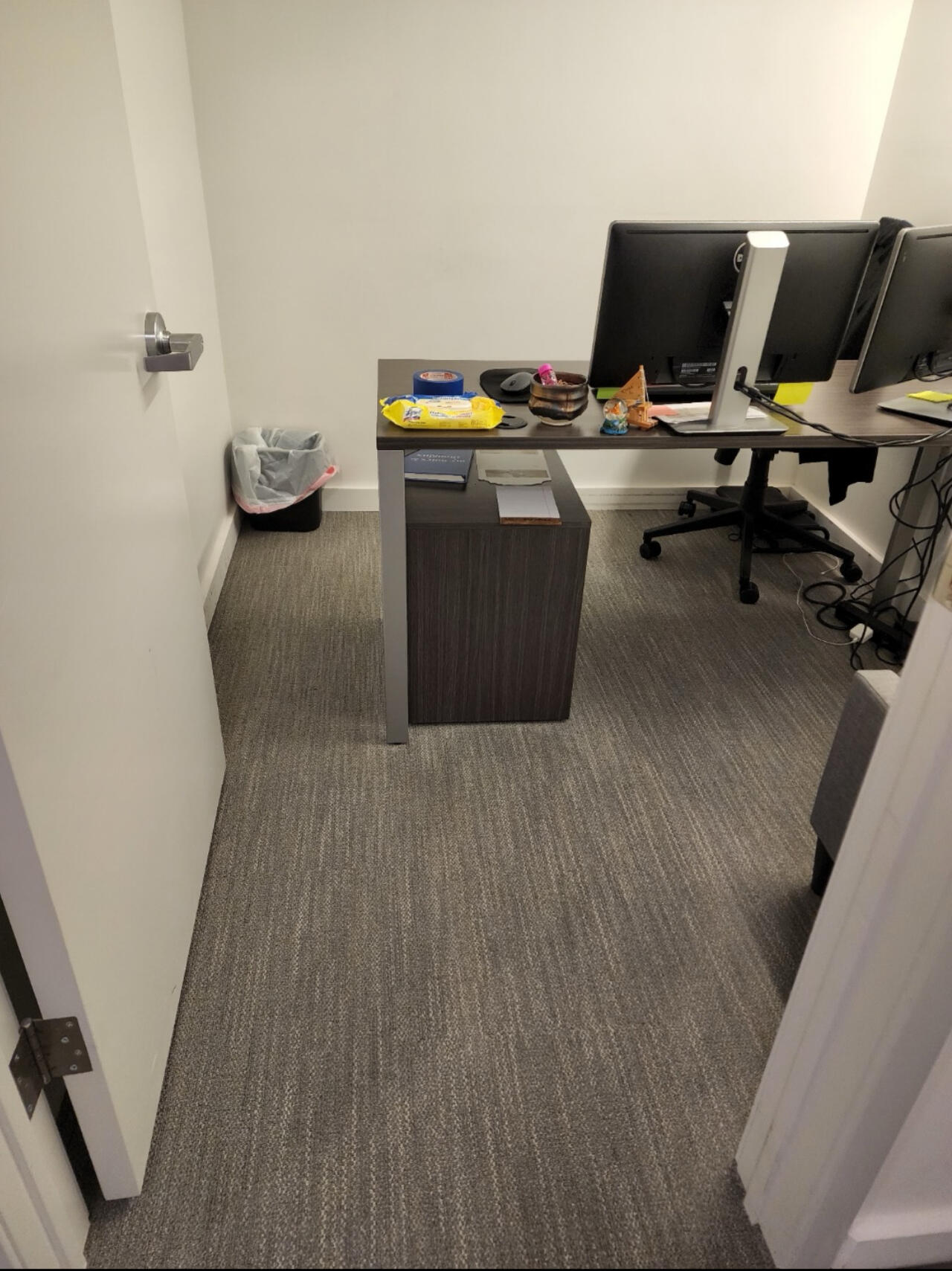 Private office with freshly cleaned carpet and a tidied desk